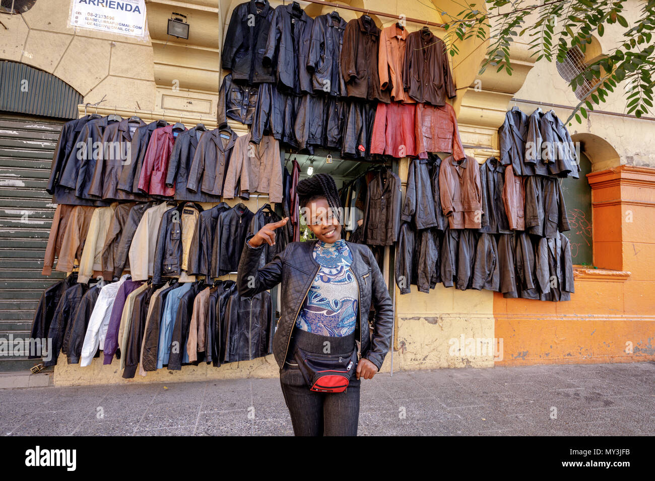 Santiago, Chile: A woman vendor of leather jackets. Stock Photo