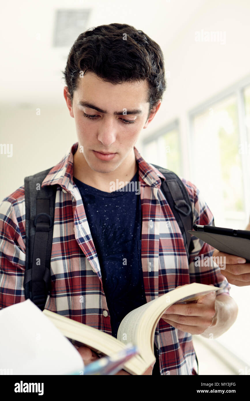 College student reading textbook Stock Photo