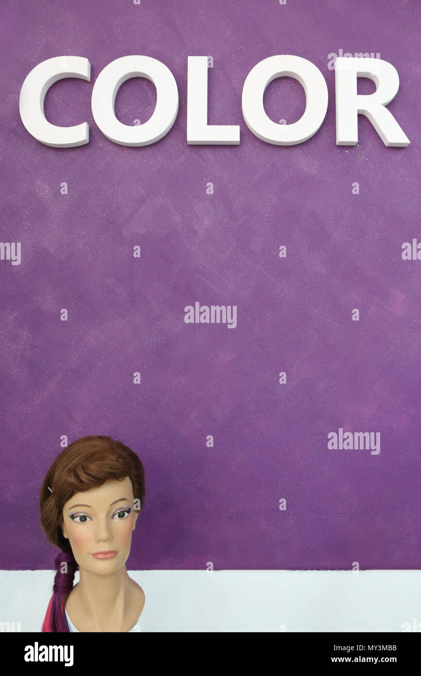 Mannequin head on a purple background Stock Photo - Alamy