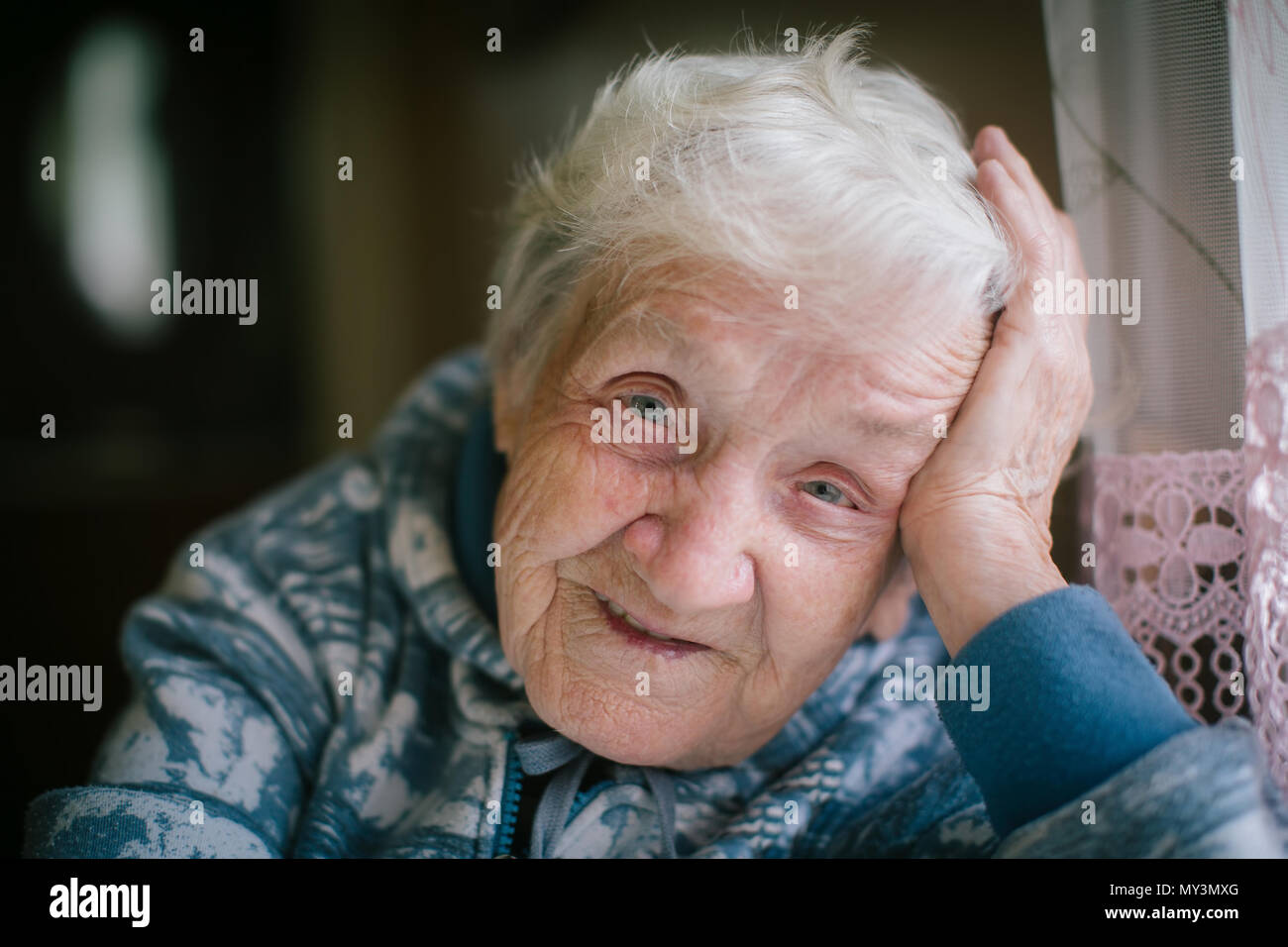 Portrait of a happy elderly woman close-up. Age 90 years old. Stock Photo