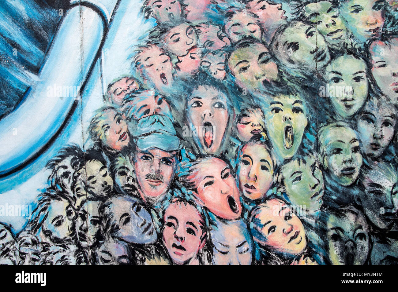 Drowning Faces on The Berlin Wall Art On the East Side Gallery Berlin Germany Stock Photo