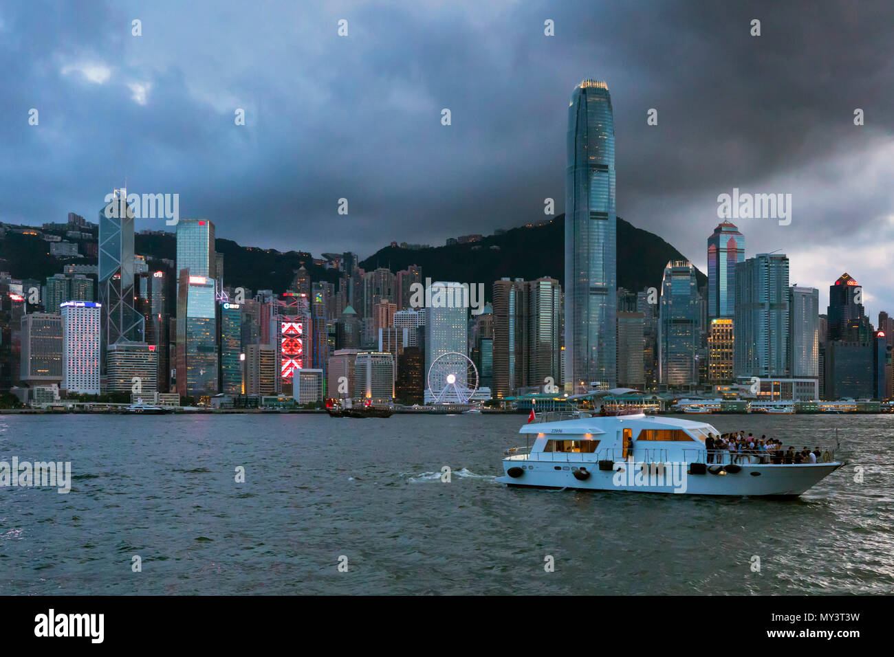 Tourist cruise and skyline, Victoria Harbour, Hong Kong, SAR, China Stock Photo