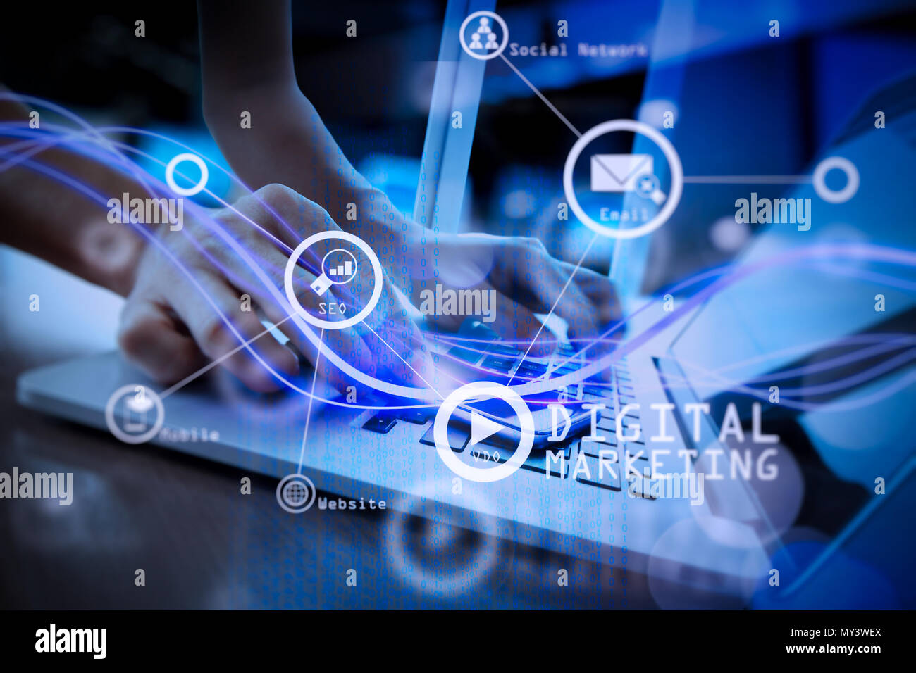 Digital marketing media (website ad, email, social network, SEO, video, mobile app) in virtual screen.Waves of blue light and businessman using on sma Stock Photo