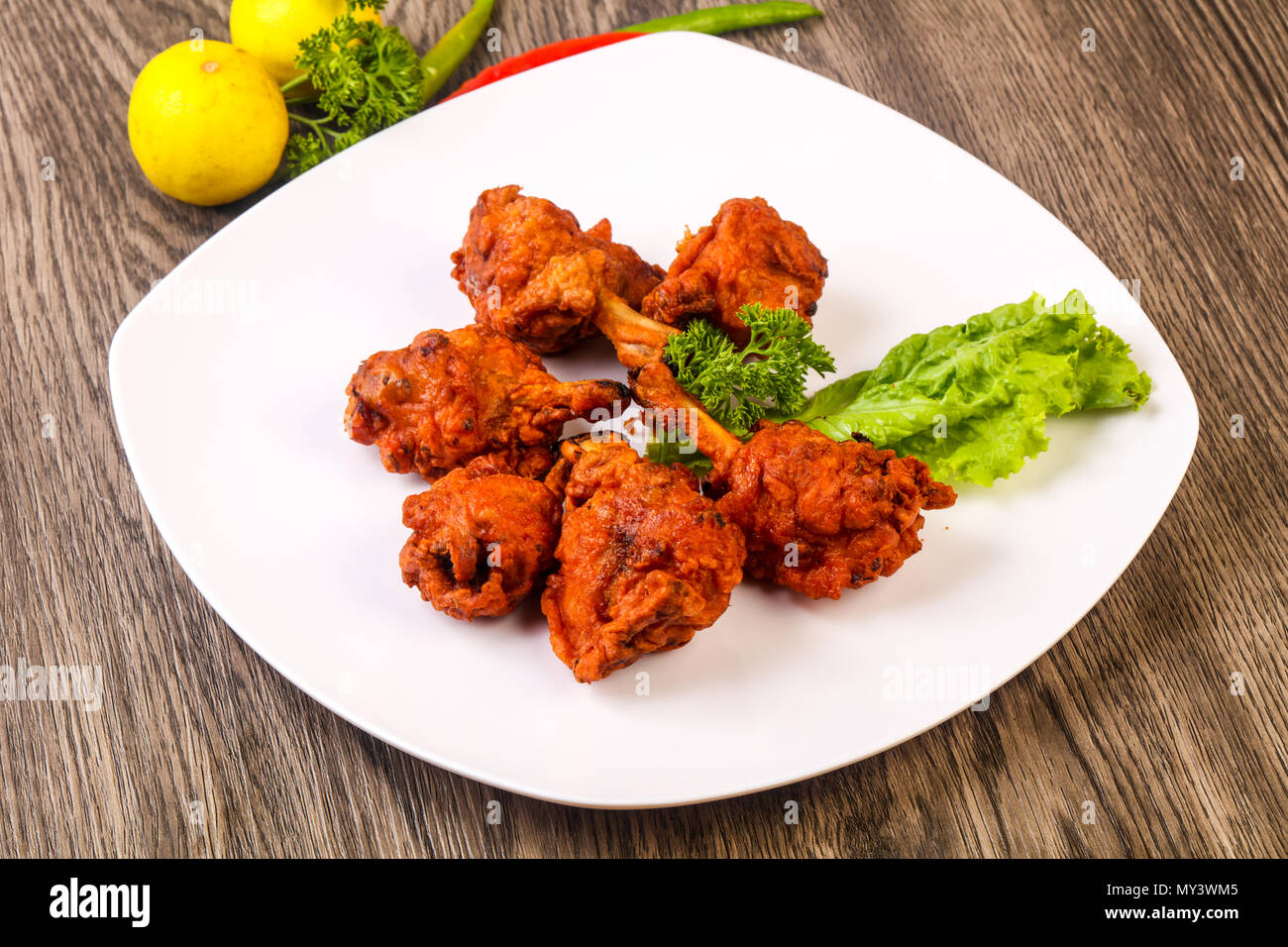 Indian traditional cuisine Chicken lollipops with spices Stock Photo