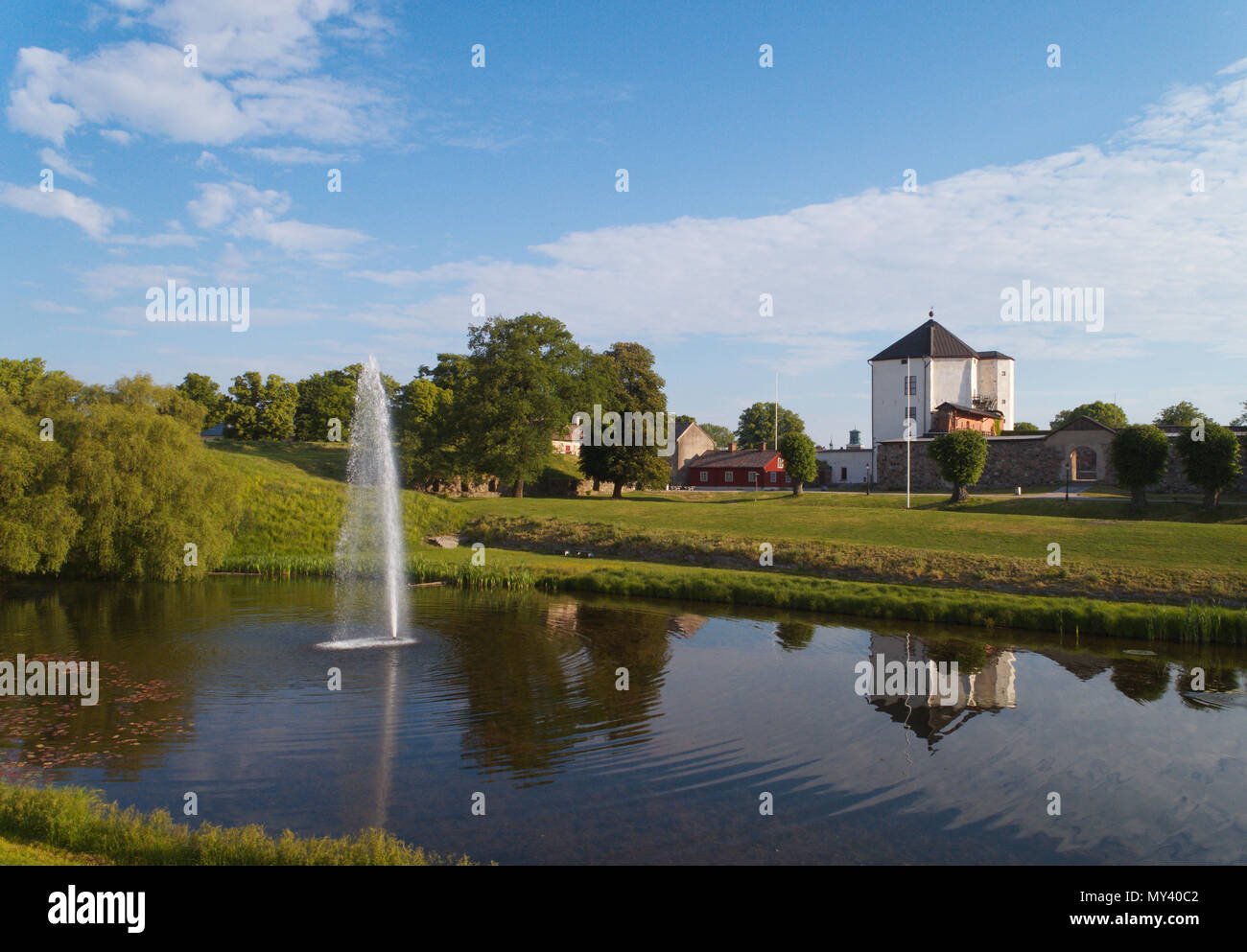 Nykoping, Sweden - June 3, 2018: Pond and fontain in front of the medeival Nykoping castle located in the Swedish province of Sodermanland. Stock Photo