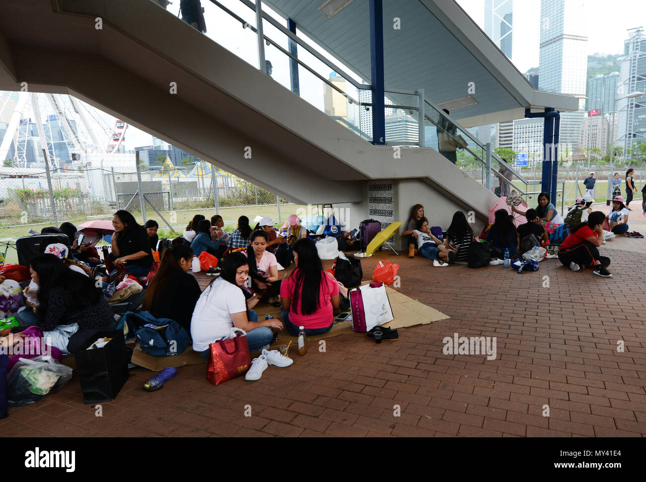 Filipino domestic helpers socializing on their Sunday day off in 'Central' , Hong Kong. Stock Photo