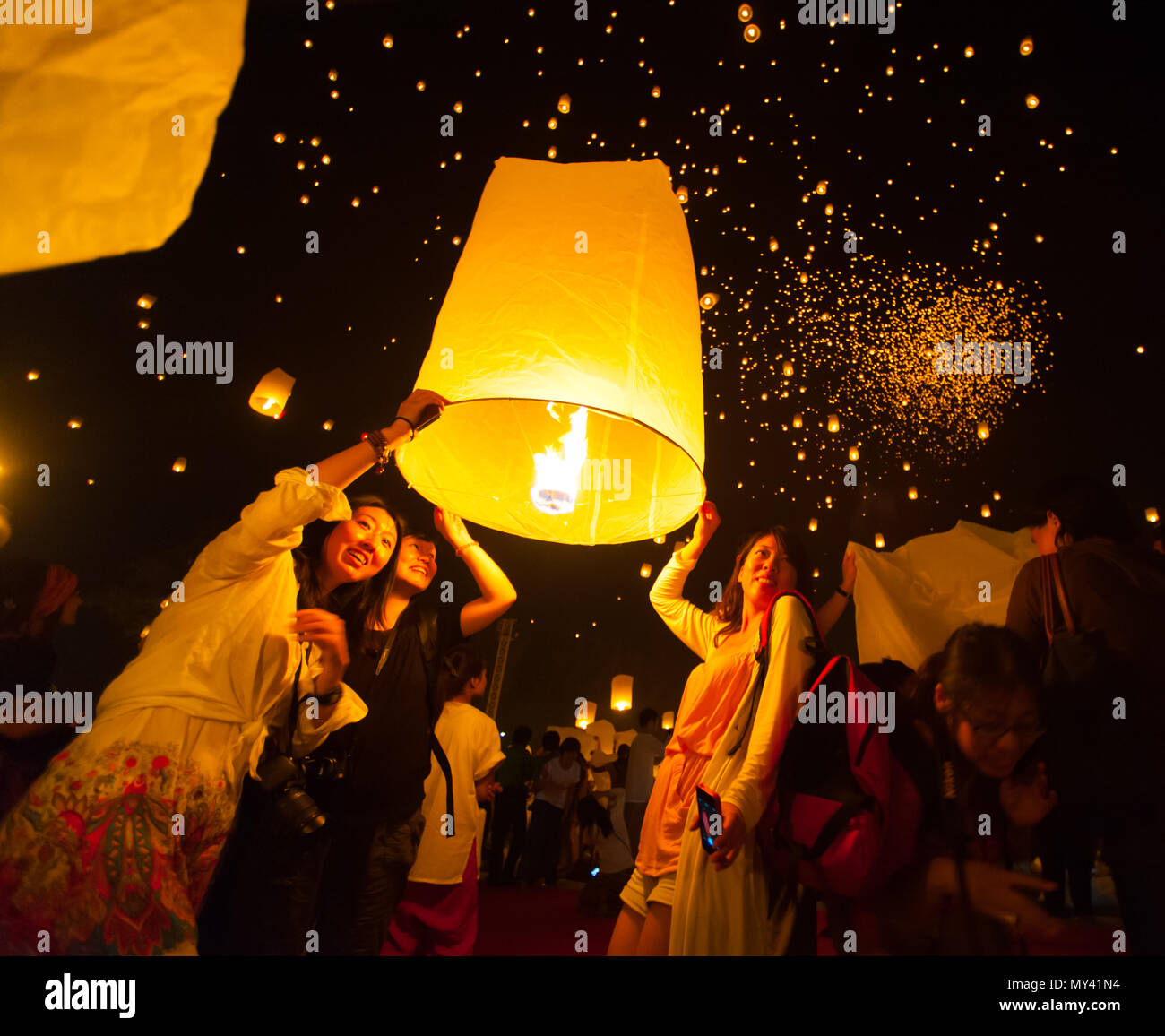 CHIANGMAI,THAILAND- NOV 16:People release sky lanterns to worship Buddha's relics in Yi Peng festival on November 16,2013 in Chiangmai,Thailand. This  Stock Photo