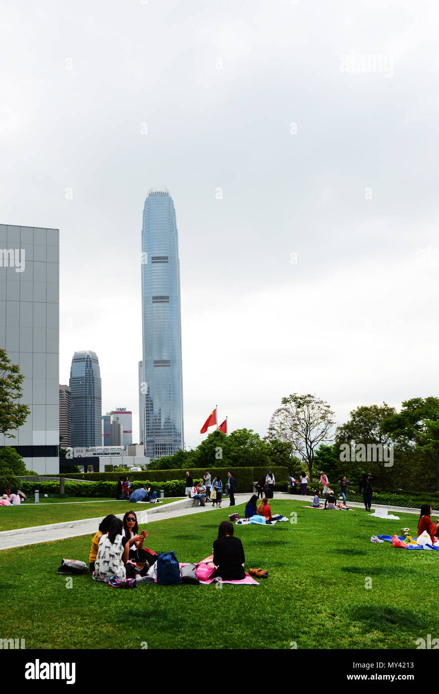 Filipina domestic helpers enjoying their Sunday day off in Tamar park in Hong Kong. Stock Photo