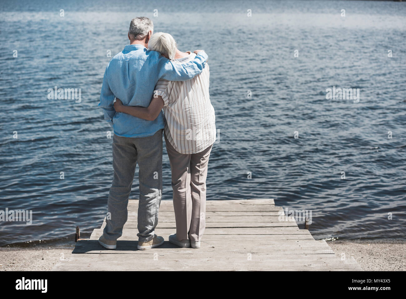 Romantic couple standing riverside hi-res stock photography and images ...