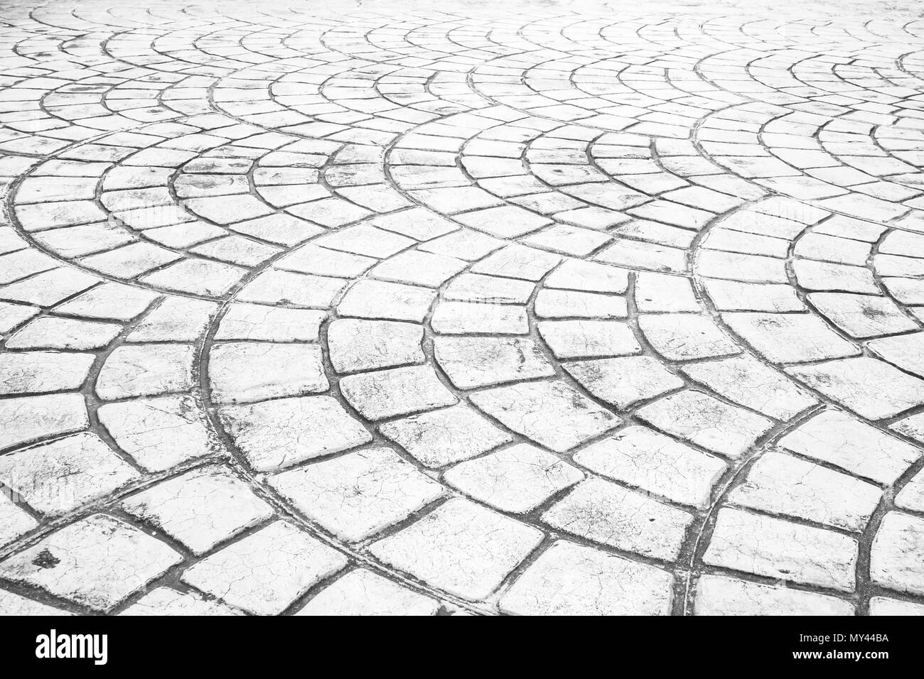 Close up perspective of stone pavement. Stone pavement texture. Granite cobble stone pavement background. Abstract background of a cobblestone pavemen Stock Photo