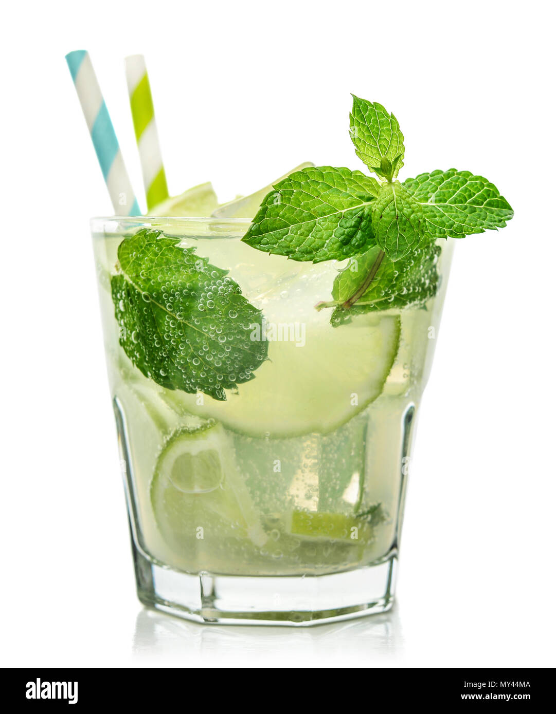 Glass of Mojito cocktail or soda drink with lime and mint isolated on white background Stock Photo