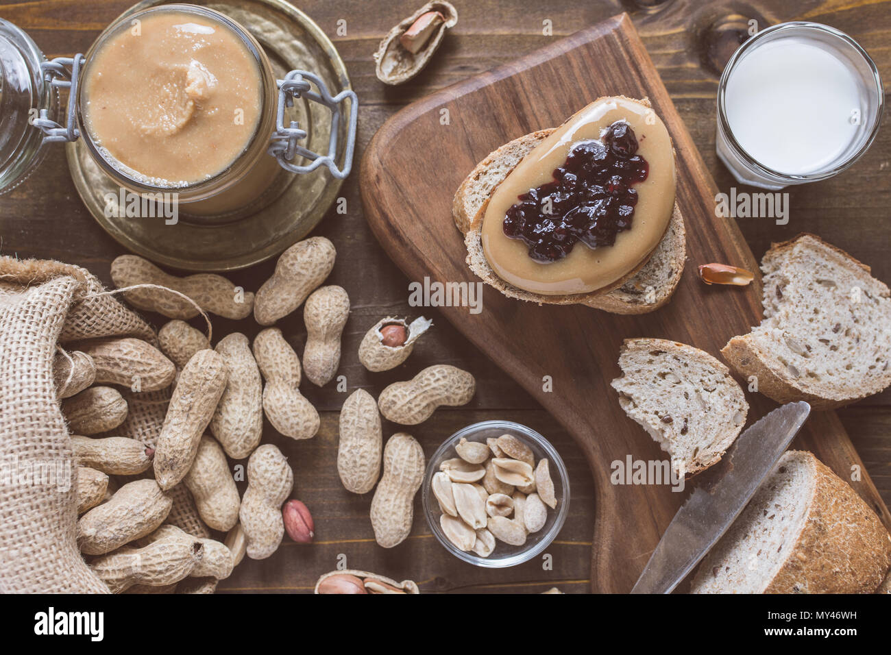 Peanut Butter and Jelly Sandwich on Rustic Wooden Cutting Board Stock