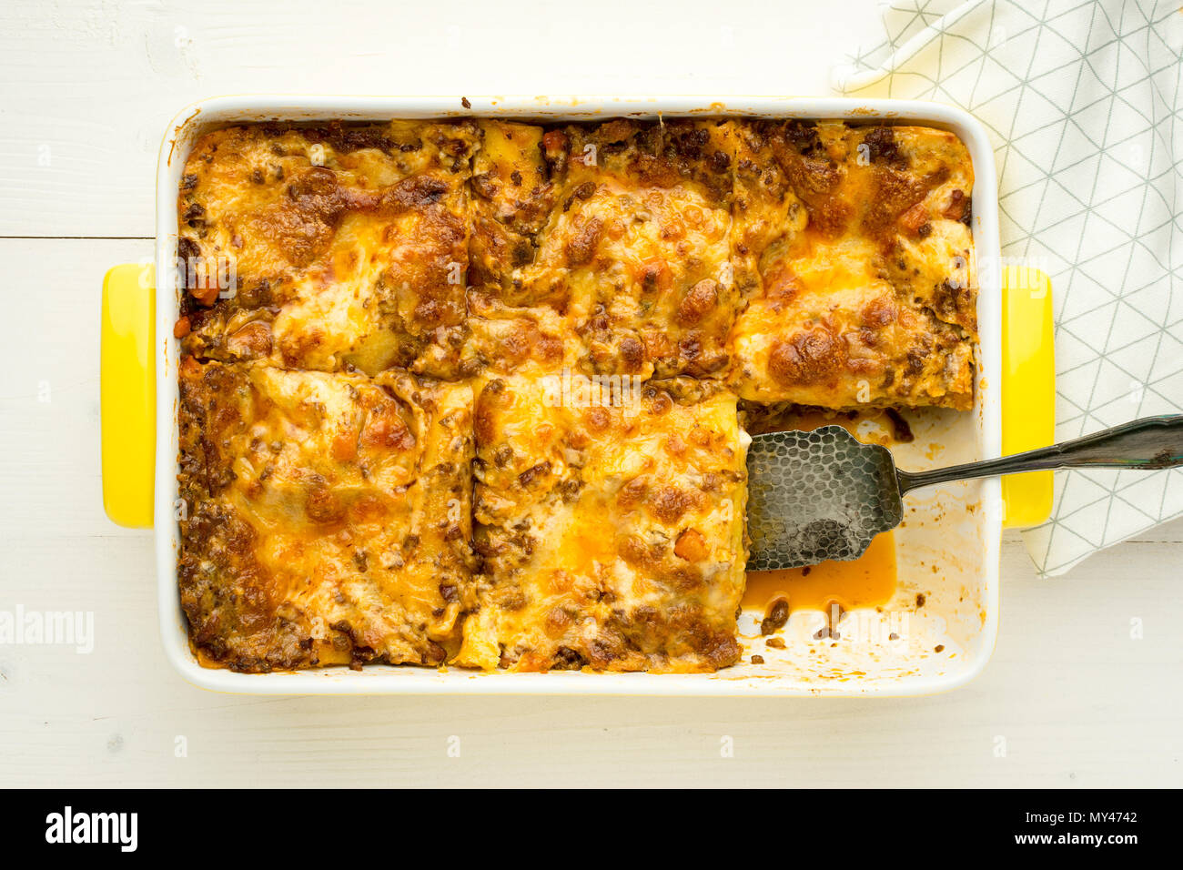 Homemade Meat Lasagna on White Wooden Table. Top View. Stock Photo