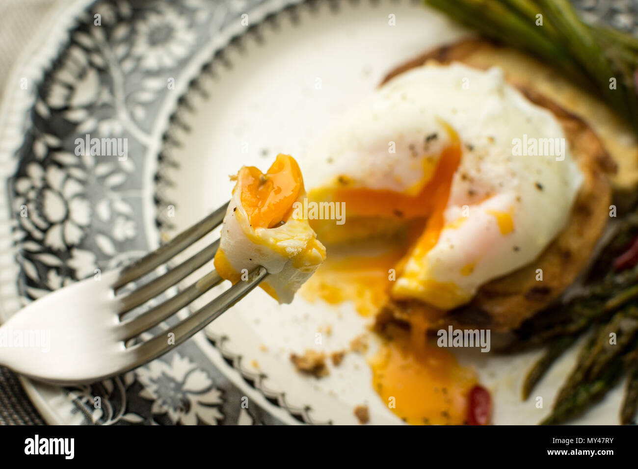 Toasted Bread with Poached Egg, Green Asparagus and Chili Peppers. Healthy Breakfast Concept. Stock Photo