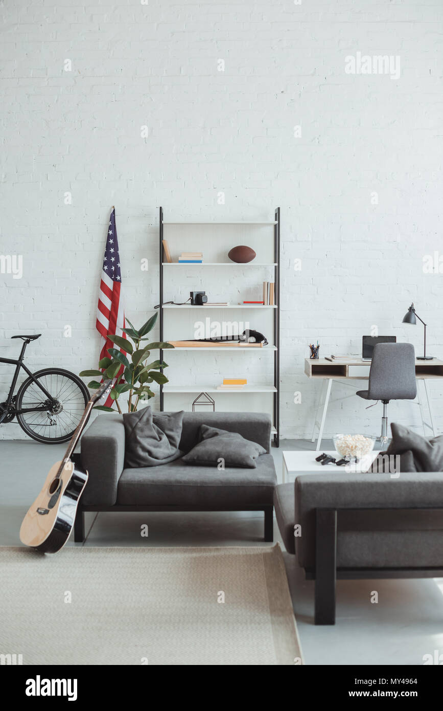 Interior Of Modern Living Room With Bicycle Guitar