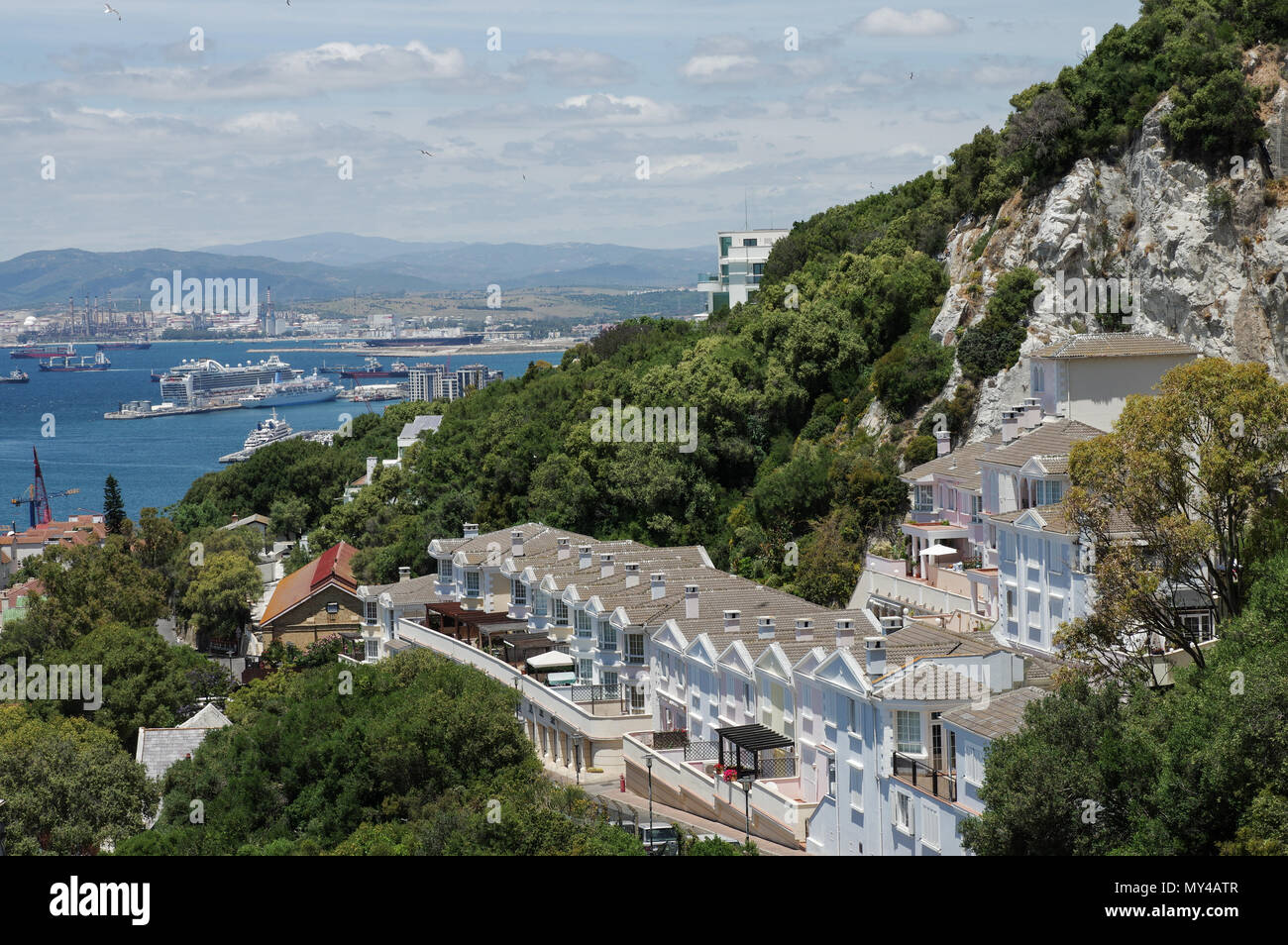 Colourful residences on Windmill Hill Road in Gibraltar, with the harbour in the background Stock Photo