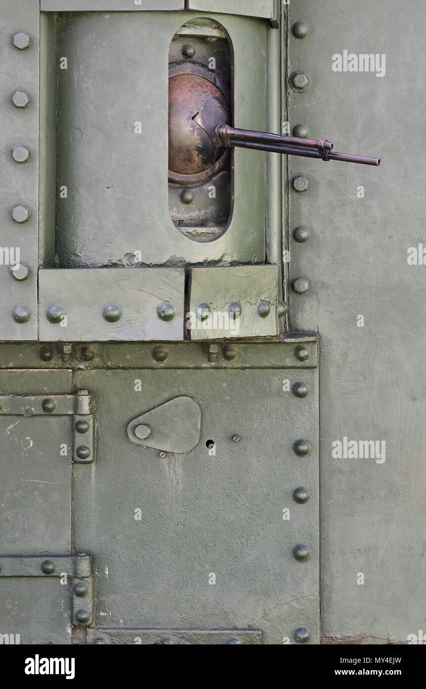 The texture of the wall of the tank, made of metal and reinforced with a multitude of bolts and rivets. Images of the covering of a combat vehicle fro Stock Photo
