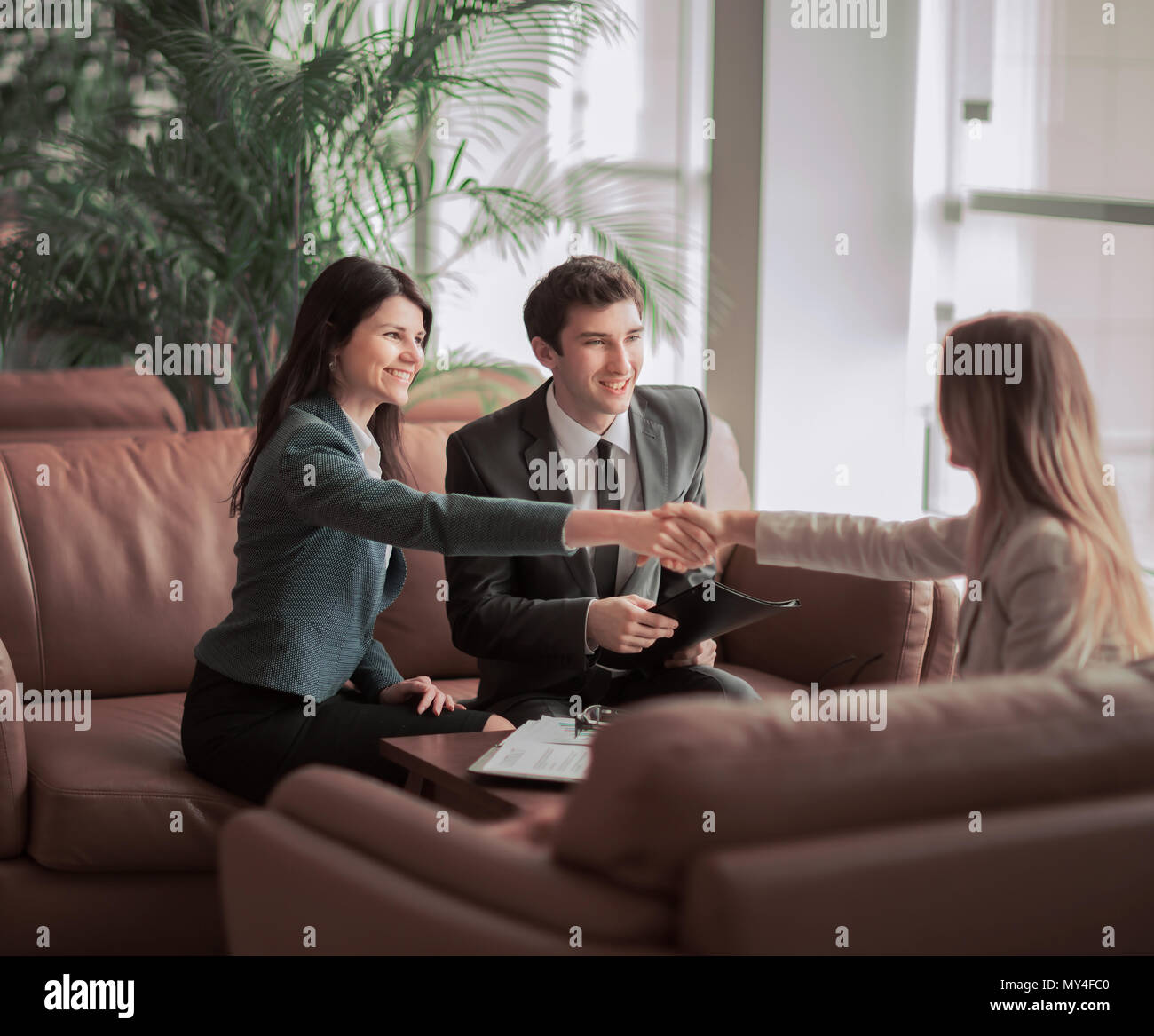 handshake of the manager and the client after the contract discussion ...