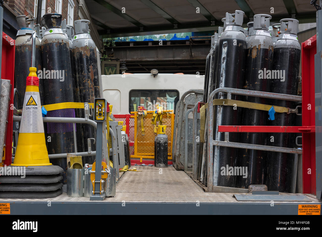 a lorry load of BOC gas bottles on the back of a truck being delivered to hospitals and licensed premises. compressed gasses for medical use and kegs. Stock Photo