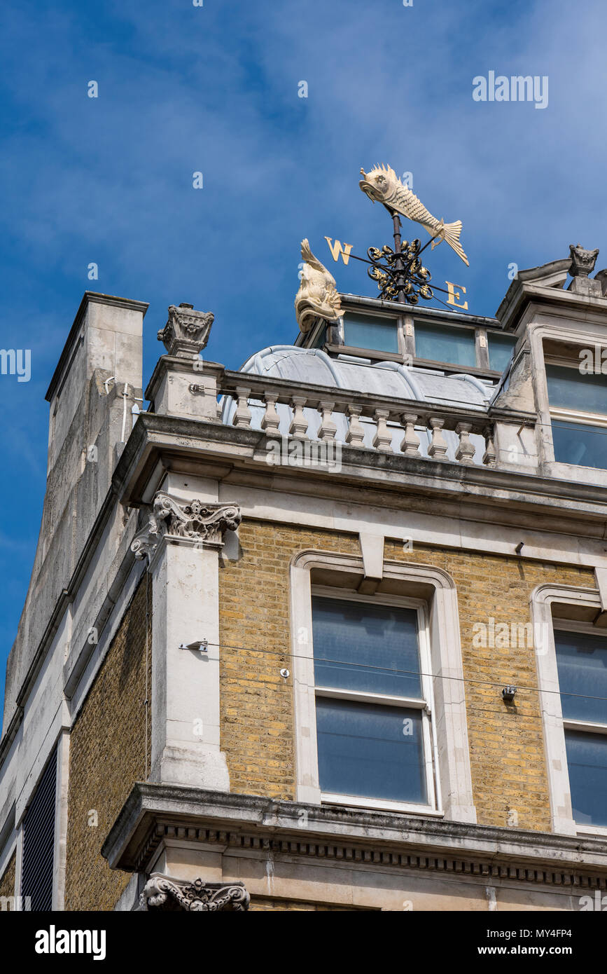 nautical styled themed weather vanes on the top of an old Victorian