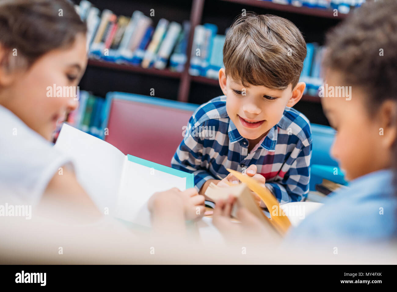 cute little kids reading books in library Stock Photo - Alamy