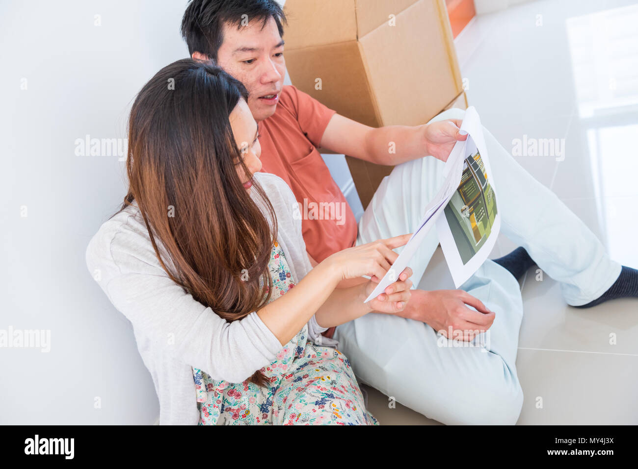 Couple buy a new house. Planing to decorate new home Stock Photo ...