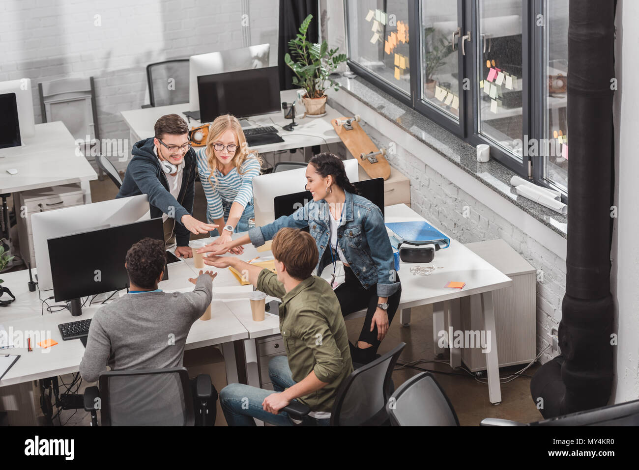 Cheerful multicultural team workers hi-res stock photography and images ...