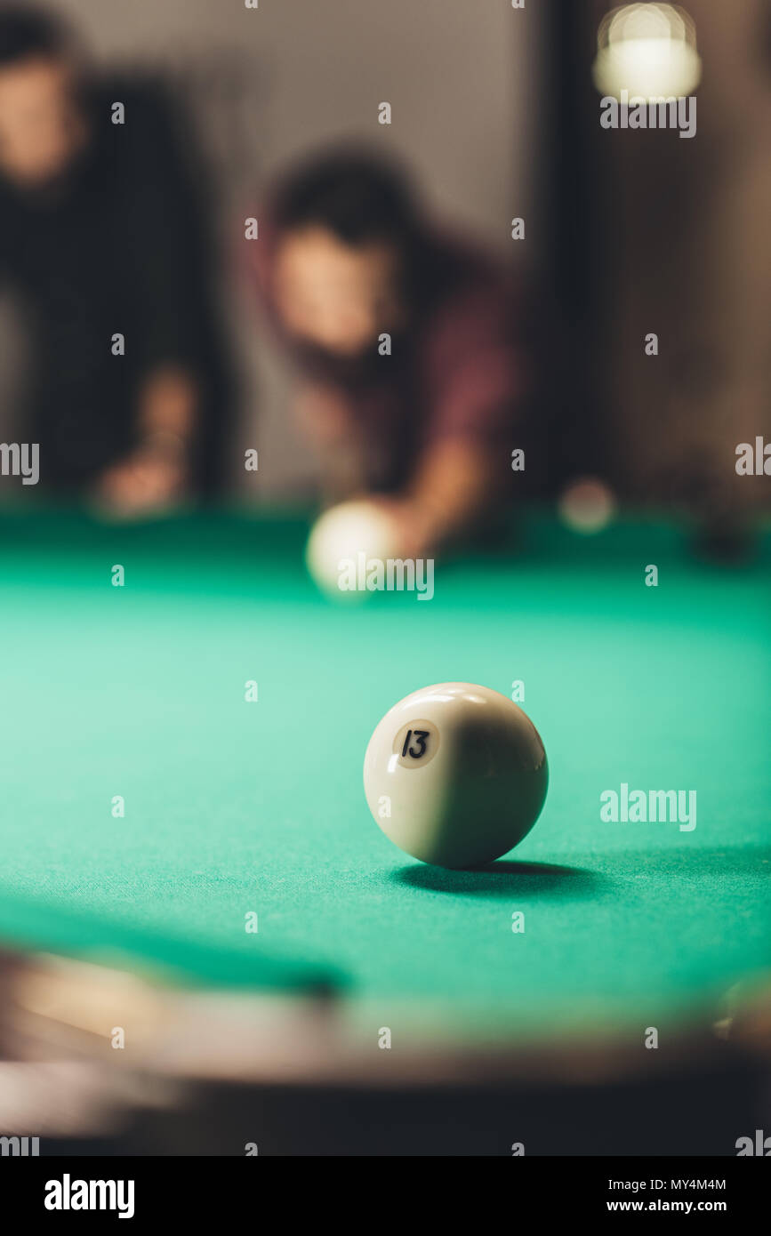 front view of men playing in russian pool. selective focus on ball Stock Photo