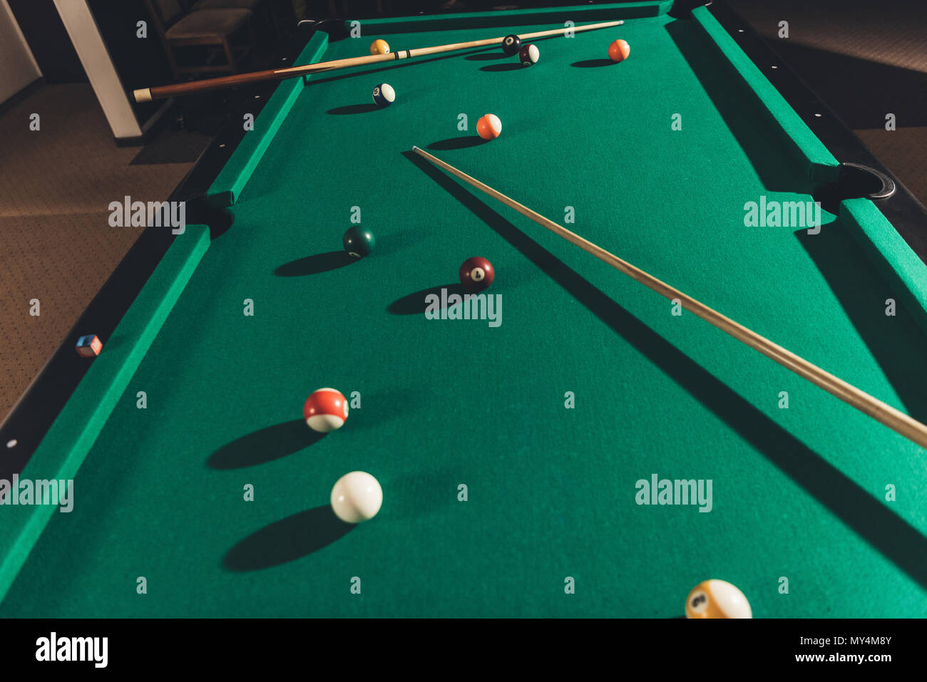 billiard gambling table with cues and balls Stock Photo