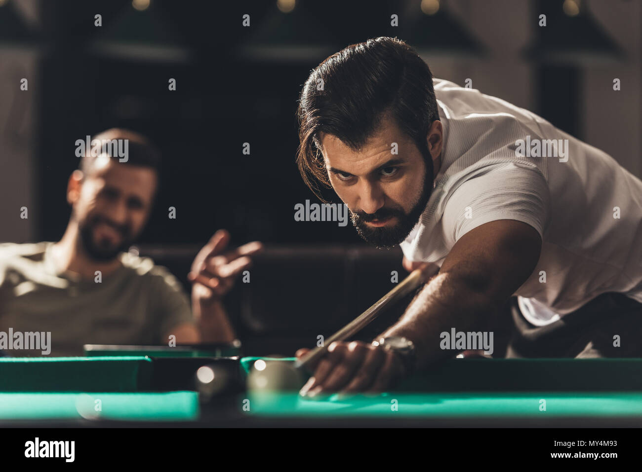 handsome caucasian man playing in snooker Stock Photo