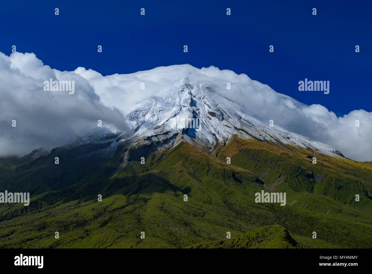 Mount Taranaki with clouds in sunny day, New Plymouth, New Zealand Stock Photo