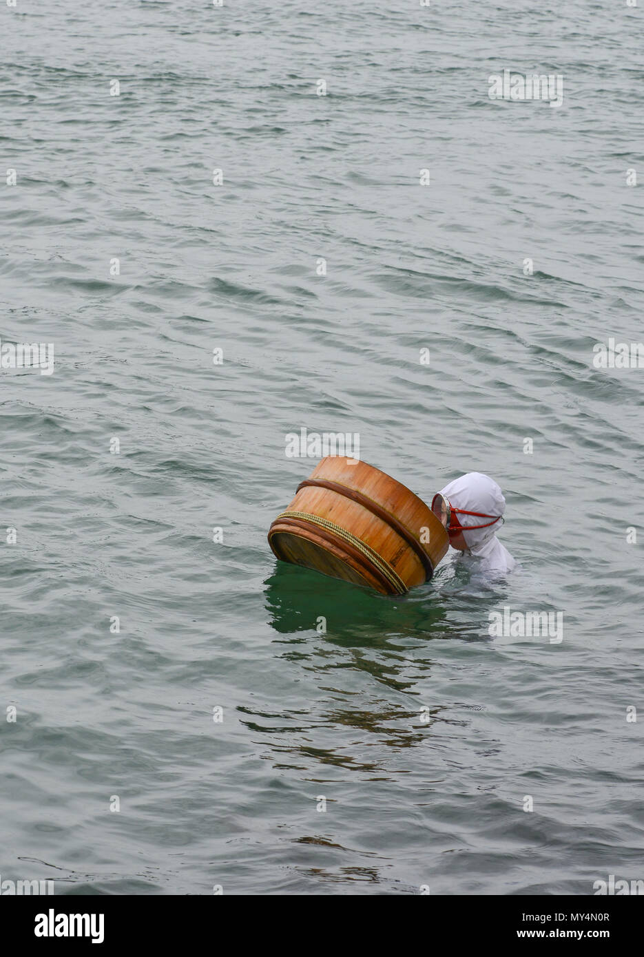 Toba, Japan - Mar 18, 2018. An Ama female diver working on the sea in