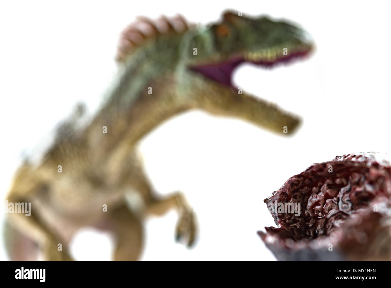 dinosaur bloody body and an allosaurus at background selective focus ...