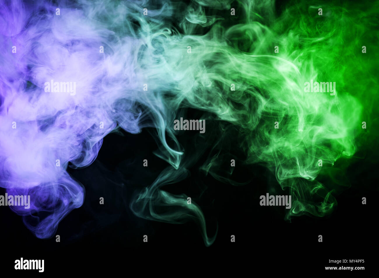 Green and blue cloud smoke on black isolated background Stock Photo - Alamy