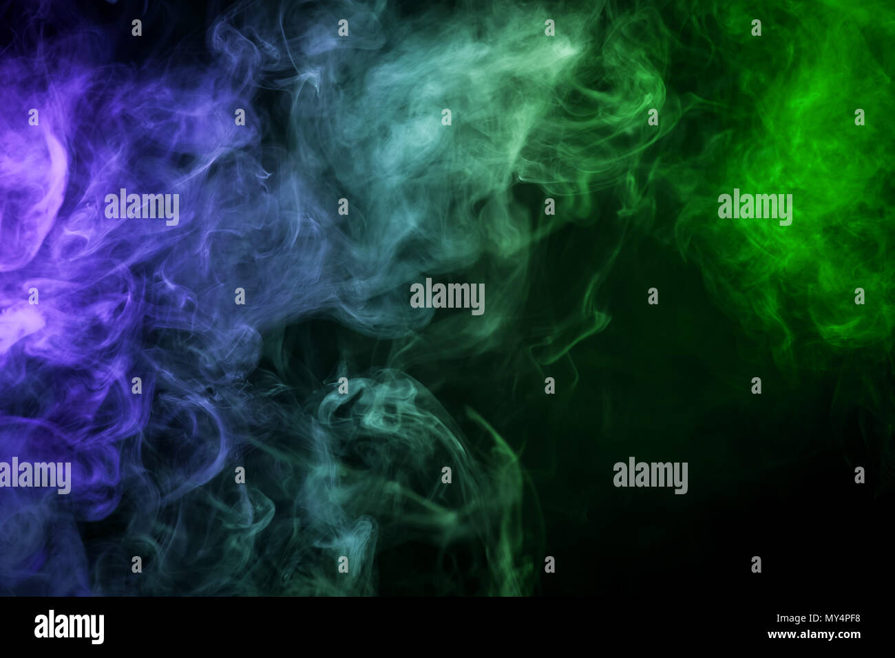 Green and blue cloud smoke on black isolated background Stock Photo - Alamy