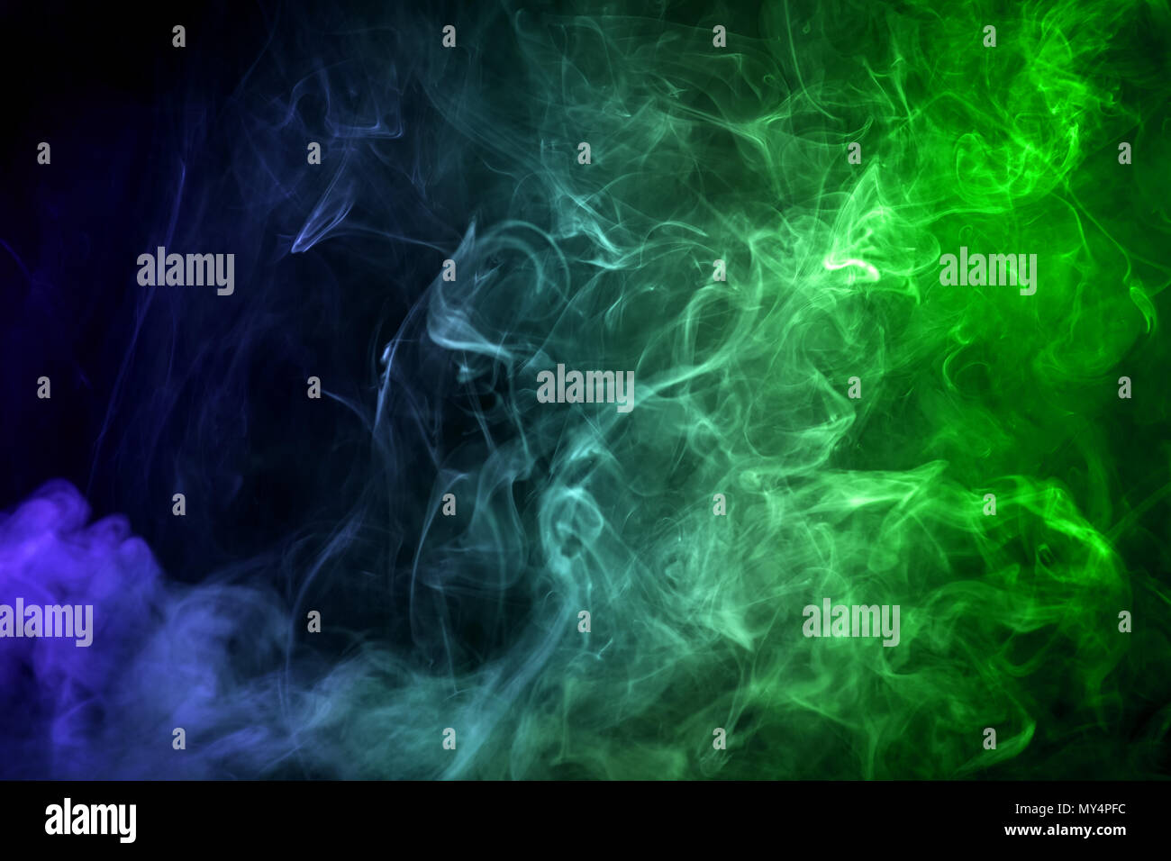 Green and blue cloud smoke on black isolated background Stock Photo - Alamy