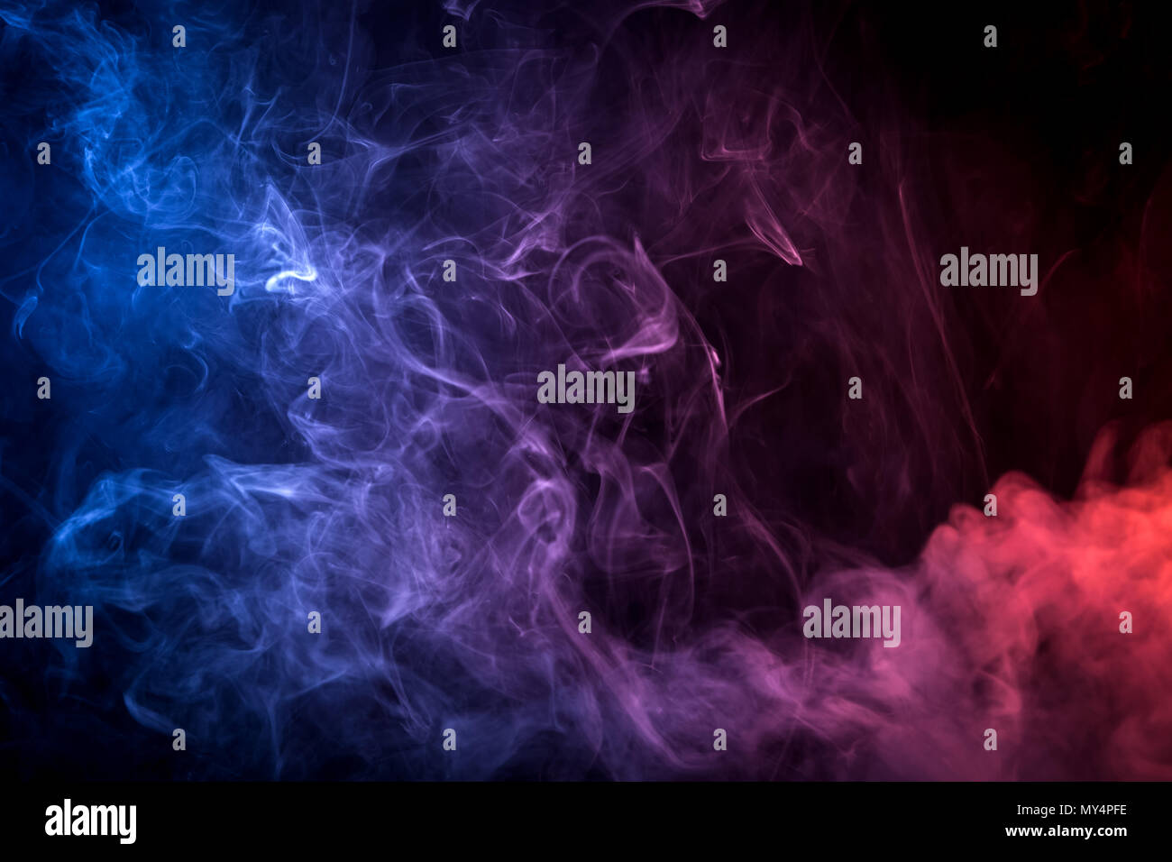 Pink, blue cloud smoke on black isolated background Stock Photo - Alamy
