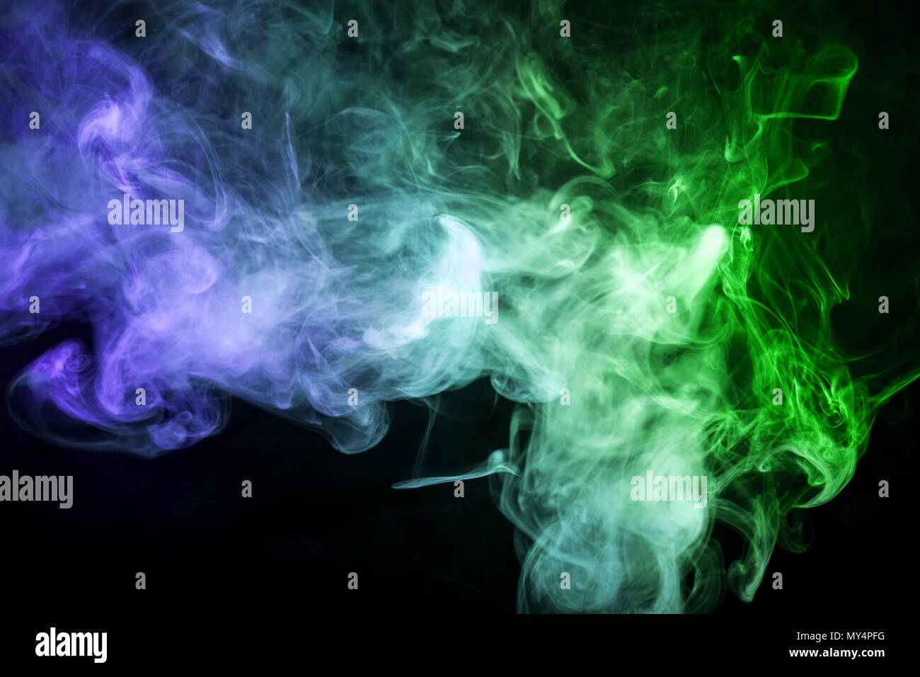 Green and blue cloud smoke on black isolated background Stock Photo - Alamy