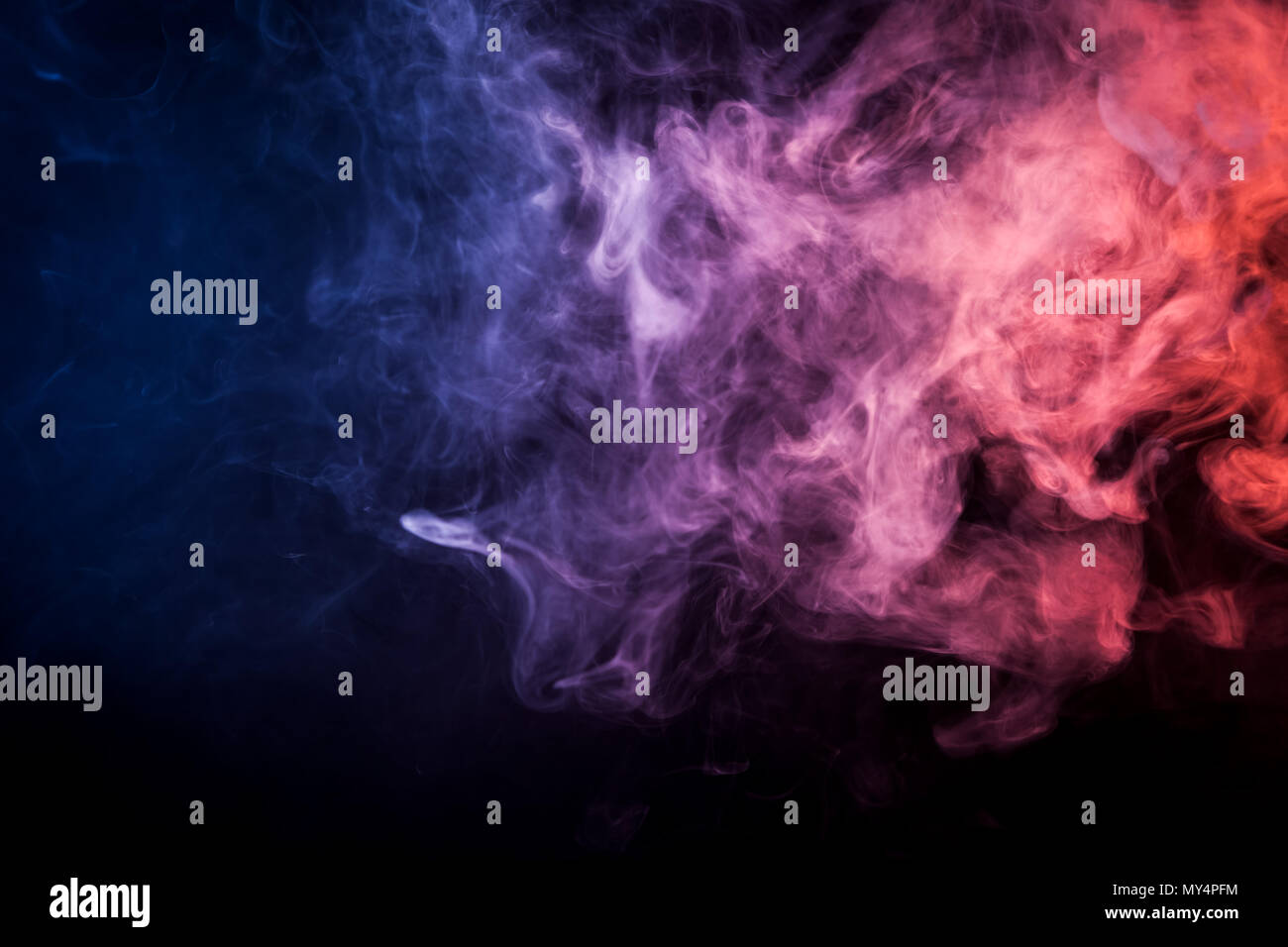Pink, blue cloud smoke on black isolated background Stock Photo - Alamy