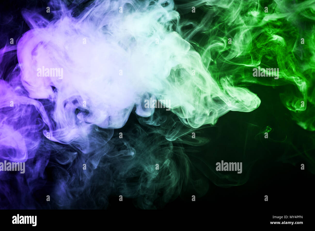 Green and blue cloud smoke on black isolated background Stock Photo - Alamy