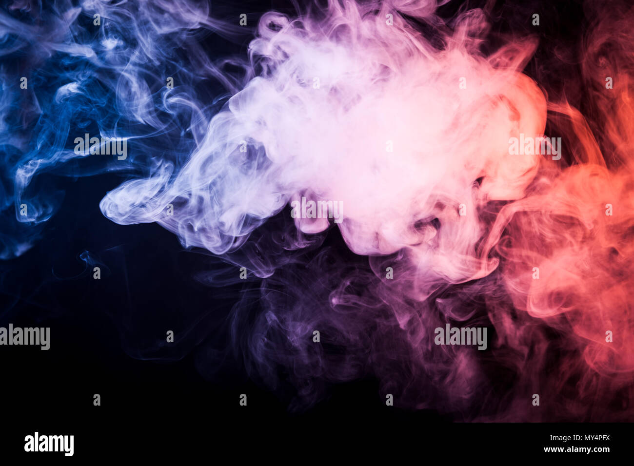 Pink, blue cloud smoke on black isolated background Stock Photo - Alamy