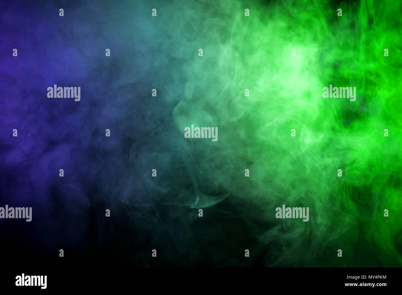 Green and blue smoke on black background Stock Photo - Alamy