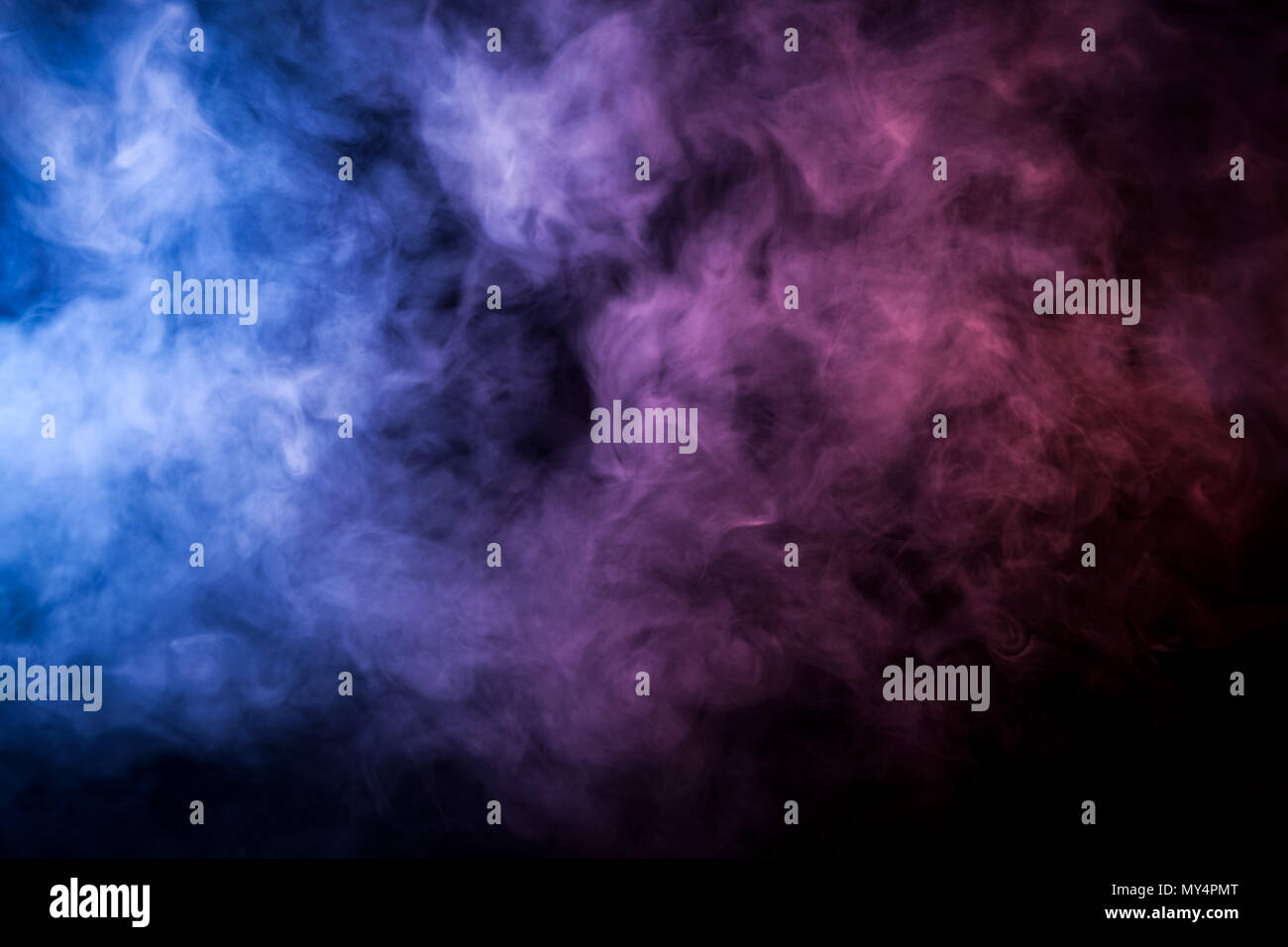 Pink and blue smoke on black background Stock Photo - Alamy