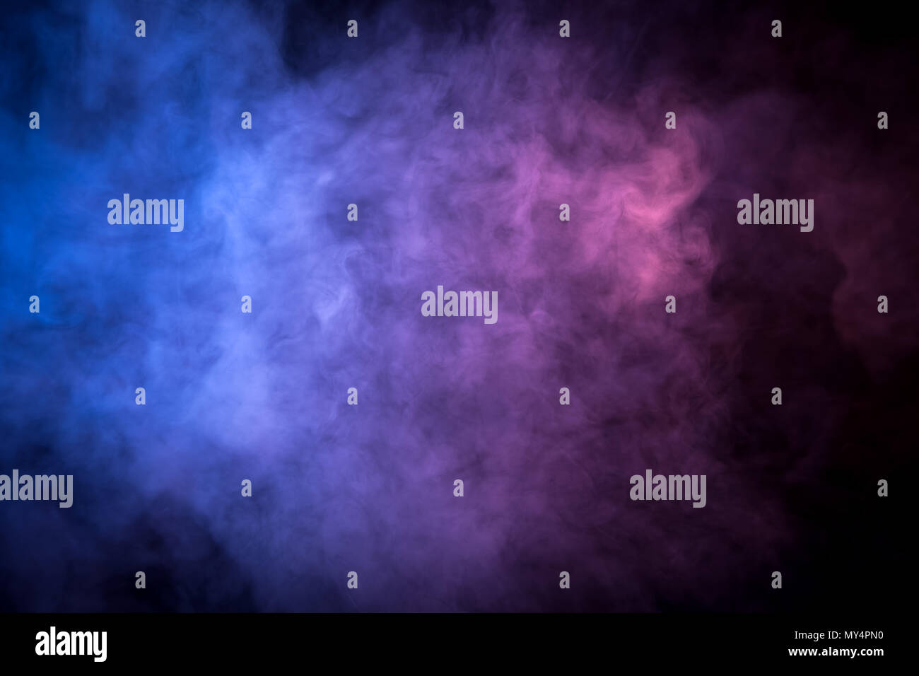 Pink and blue smoke on black background Stock Photo - Alamy