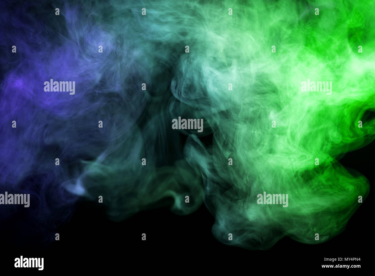 Green and blue smoke on black background Stock Photo - Alamy