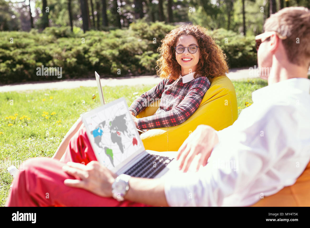 Cheerful students working on their projects Stock Photo