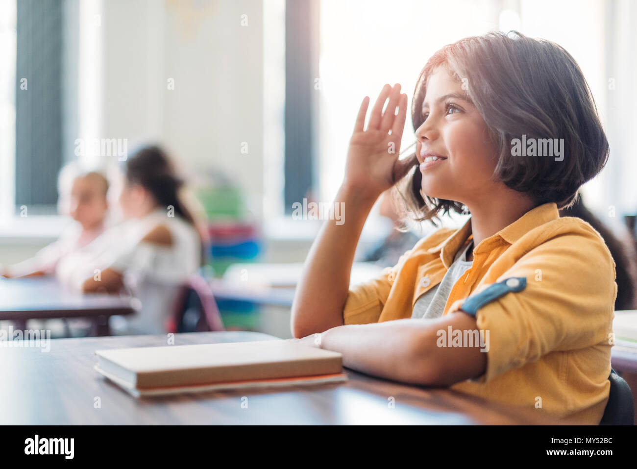 adorable african american schoolgirl raising hand in class Stock Photo ...