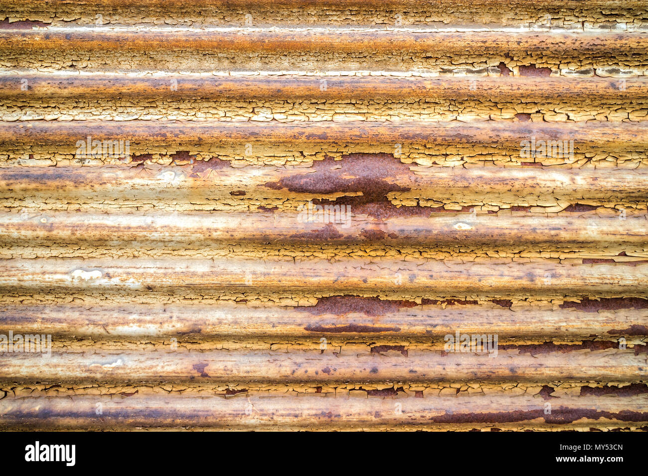 Old weathered rustic fold able garage gate close up Stock Photo