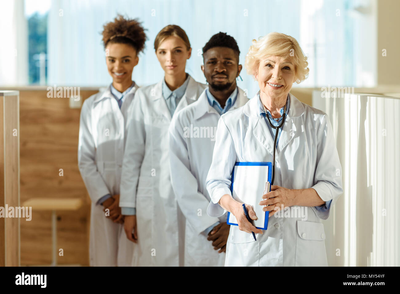 Row of lab coats hi-res stock photography and images - Alamy