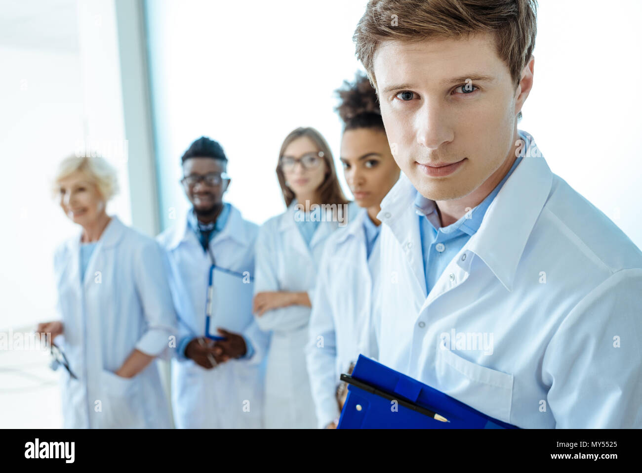 Row of lab coats hi-res stock photography and images - Alamy